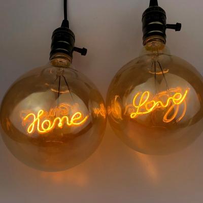 China All Decorative Lighting Use Clear/Gold G125 Edison Bulb With Word Love Glass Decorative Lamp Globe And Soft Curved 4W 2200K Dimmable LED Filament Home Bulb for sale