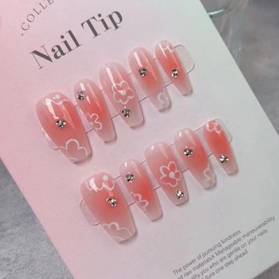 China Design Wholesale Price Handmade Pink Background Cute White Flower Painting Nail Frech Long Press On Nail For Gift for sale