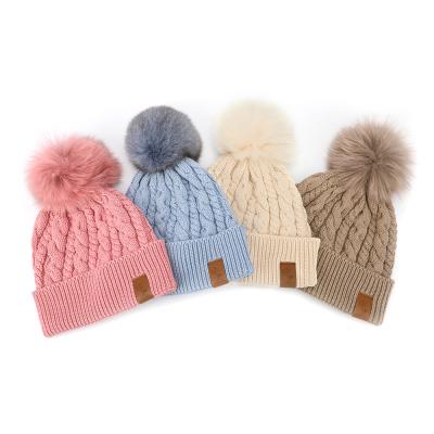 China Custom Made High Quality Winter COMMON Merino Soft Warm Pom Pom Hat Caps Leather Label Wool-acrylic Deep Knit Beanie For Women for sale