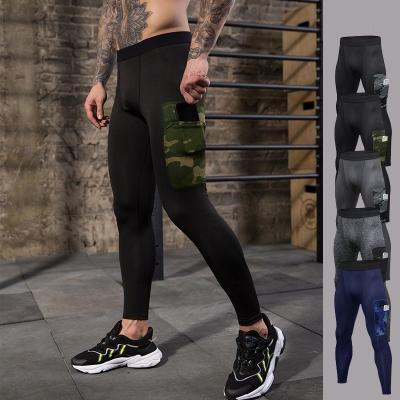 China New Anti-wrinkle compression sports gym running leggings with phone pocket training men's sports tight pants for sale