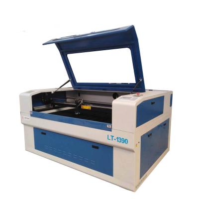 China 1390 CO2 Laser Engraving Cutting Machine For Plastic Fabric MDF Laser Cutting Machine for sale