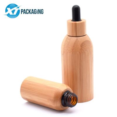 China Cosmetic 4oz 50ml empty brown orange refillable eye glass bottle bamboo dropper with wooden bamboo cap for sale