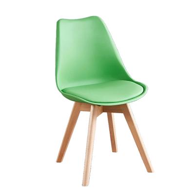 China 2023 Modern Newest Designer Restaurant Chairs Plastic Dining Chair Wood Legs for sale