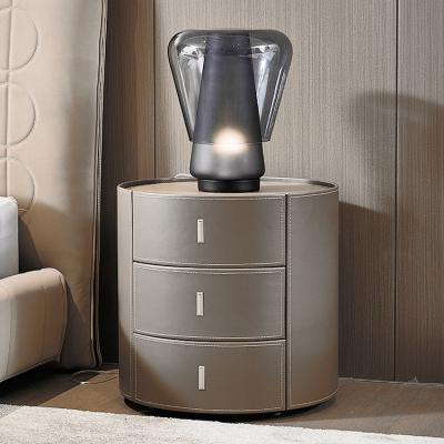 China Other Gray Hotel Bedroom Furniture Saddle Leather Nightstand Modern Stone Top High End Round Bedside Table for sale