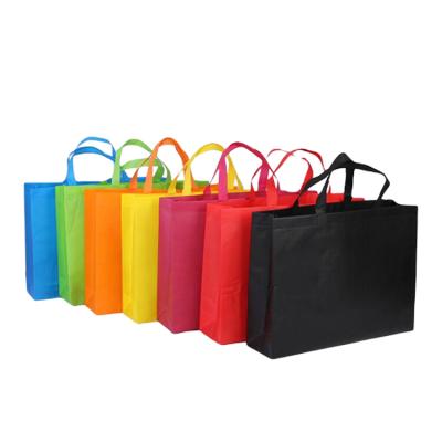 China 100% eco-friendly wholesale custom logo colorful non woven shopping bags with handles for sale