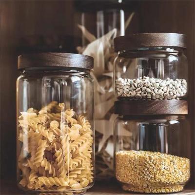 China Wholesale Luxurious Freshness Keeping Round Clear Kitchen Glass Storage Jar Set With Acacia Wood Lid for sale