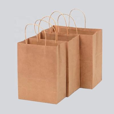 China Materials Recycled Into Stock Manufacturer Cheap Low Cost Christmas Brown Kraft Paper Bag For Clothing/Gift/Food/Packaging for sale