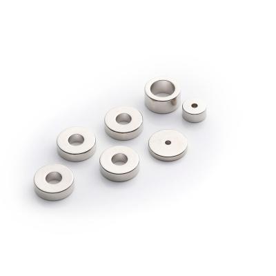 China Custom Round Disc Neodymium Permanent Magnets Industrial Rare Earth Magnet Cup Form WELD With Countersunk Screw Hole Bending for sale