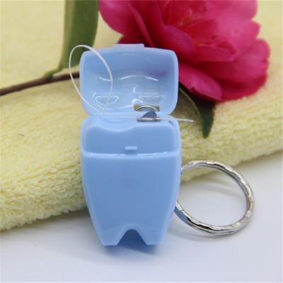 China High Polyester China Factory OEM Tooth Shape Dental Floss With Key Chain In Blister Card for sale