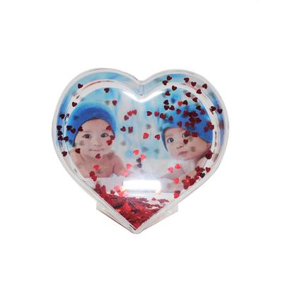 China Europe Heart Shape Plastic Water Photo Frame Snow Globe for sale