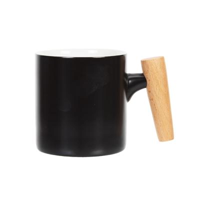 China Custom Viable Good Quality Logo Printed Matte Black Ceramic Coffee Mug With Special Wooden Handle for sale