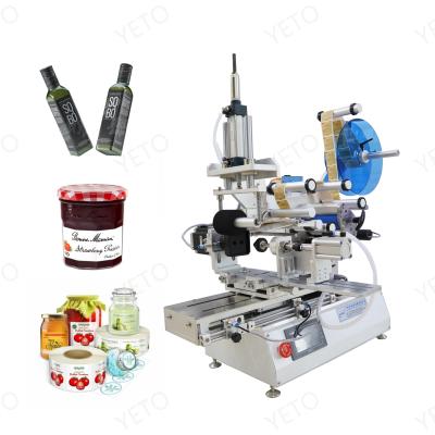 China Cheap Food Table Top Manual Lighter Flat Pet Printing Lotion Liquids Wash Bottle Labeling Machine With Transparent Label Sensor for sale