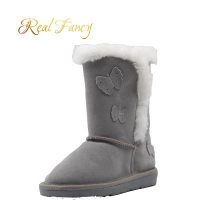 China Fashion Trend Cow Suede Butterfly TPR Patch TPR Winter Child Upper Unique Boots for sale