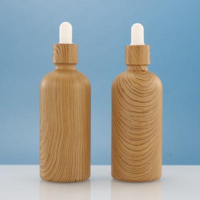 China 30ml 1oz Essential Oil Cosmetic Bamboo Glass Cap Bamboo Dropper Bottle With Paper Tube for sale