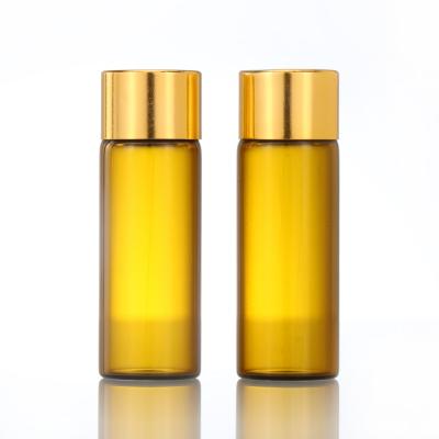 China Cosmetic Amber Screw Bottle Essential Oil Bottles Glass Vials With Gold Cap for sale