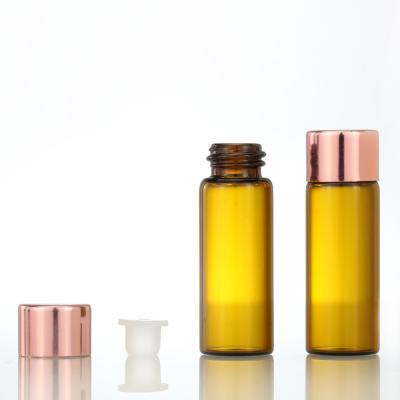 China Amber Glass Cosmetic Screw Bottle Essential Oil Bottle Vials With Rose Gold Cap Sample Bottle for sale