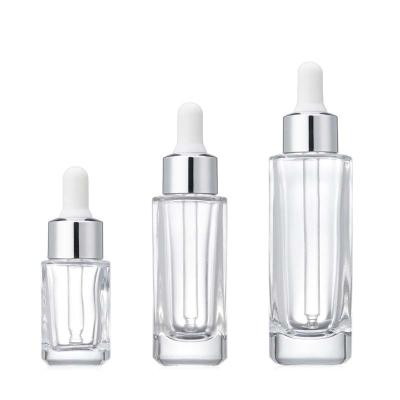 China Transparent Square Portable Essential Oil Bottle Cosmetics Empty Cosmetic Dropper Bottle for sale