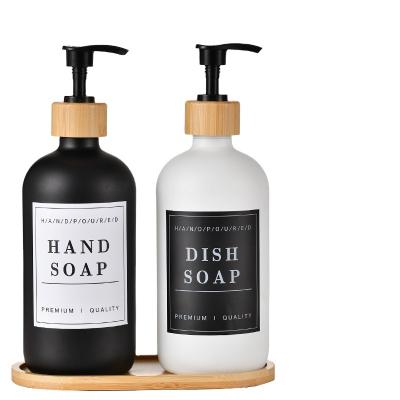 China Bamboo pump white color hand washing glass bottle with bamboo pump 250ml black glass sanitizer bottle with bamboo pallet for sale