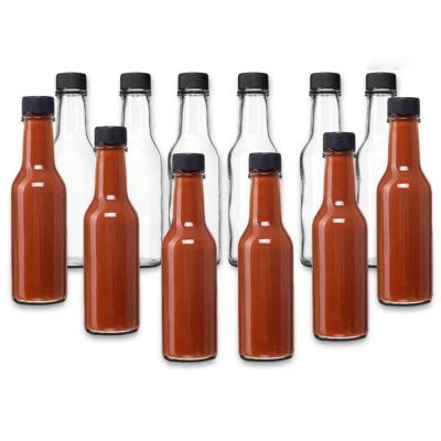 China Food Low MOQ 100ml 150ml 200ml Bulk glass chili sauce bottle with plastic lid shrink for sale