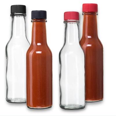 China Food best selling 3oz 5oz 7oz glass bottle with plastic lid and shrink for chill tomato ketchup glass bottle for sale