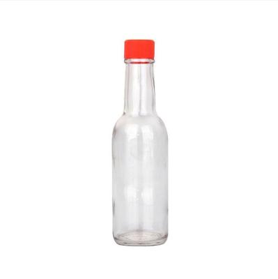 China Food 250ml chill glass bottle with red  plastic lid  insert best selling sauce glass bottle with shrink for sale