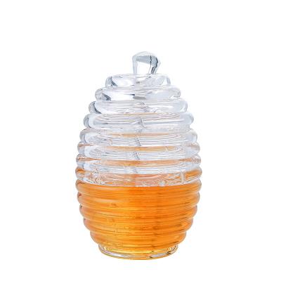 China Sustainable Wholesale Bee Shape Empty Glass Jars For Honey , Honey Pot With Glass Lid Dipper for sale