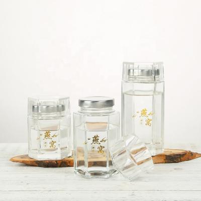 China Food 80ml Honey Jar Food Grade Clear Hexagonal Empty 120ml Bird's Nest Packing Glass Jar With Screw Metal Lid for sale