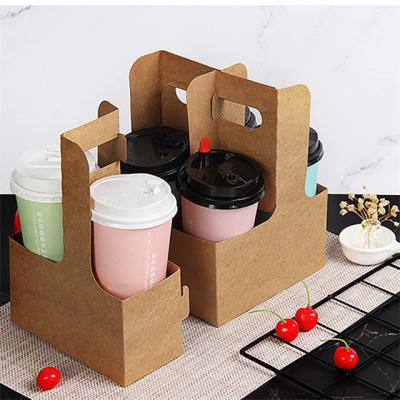 China Customized Disposable Drinks Cardboard Papercup Takeaway Hot Carrier With Handle Wrapping Paper Disposable Bubble Tea Coffee To Go Paper Cup Holder for sale