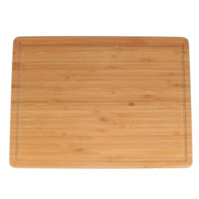 China Viable good quality handmade natural bamboo cutting board with juice flutes for cookies for sale