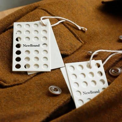 China Viable Wholesale Hollow Dot Custom Logo Clothing Tag String Hang Tag For Clothing Own Logo Te koop