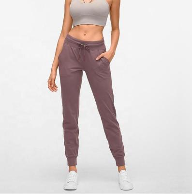 China Anti-Wrinkle Sportswear Plain Logo Women's Custom Tracksuit Stacked Gym Joggers Pants With Side Pockets for sale