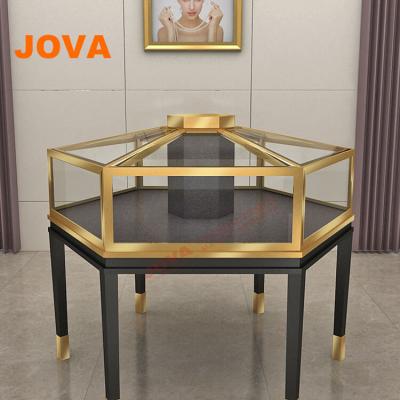 China Concise Luxury Metal Frame Hexagon Counter Case Jewelry Display Showcase for sale