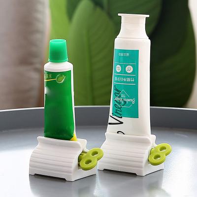 China 3Colors Viable Hot Seller Creative Plastic No Waste Lazy People Detergent Toothpaste Squeezer Facial Toothpaste Dispenser for sale