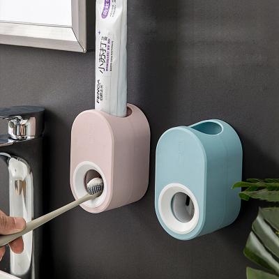 China Viable Success 4Colors No Drilling People Toothpaste Wall Mounted Lazy Squeezer Holder Automatic Toothpaste Dispenser for sale