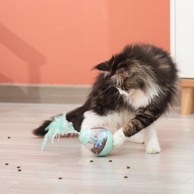 China Viable Hot Interactive Plastic Dispenser Feather Tumbler Electric Cat Toy for sale