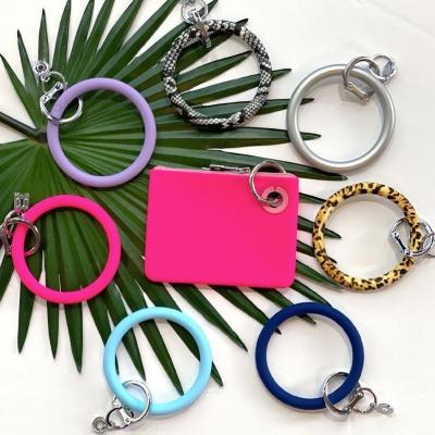 China Fashion Wrist Bracelets Key Chain PU Earphone Bag Hand Ring Bracelet Coin Purse Women Key Chain Card Female Package for sale