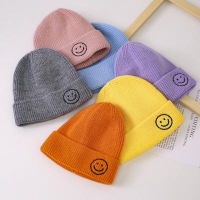 China JOINT Custom Cute Kids Candy Color Beanie Hats Baby Amazon Smile Solid Simple Pattern Knitted Beanie Hats for sale