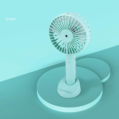 China New 2021 Mini Fan Stand Small Air Cooling +Moisturizing Humidifier Portable Hand Fan Stand Small Rechargeable Unique Handheld Cold Water Jet for sale