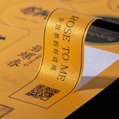 China Waterproof Made in China Gold Foil Printing Adhesive Sticker Printing Logo Sticker Label Roll Printing for sale