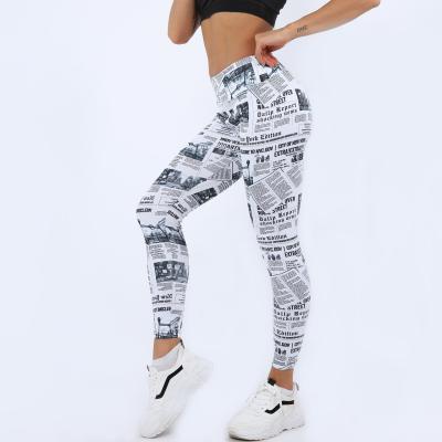 China Digitally Printed Breathable Yoga Women's Tight Cropped Newspaper Gradient Pants for sale