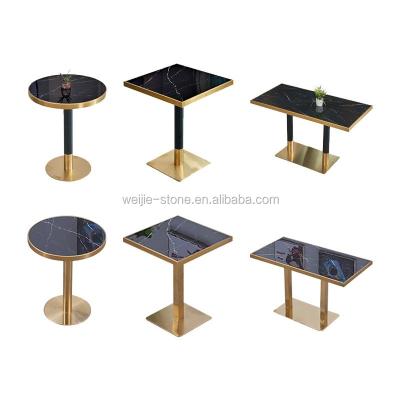 China Modern new design dining table and black natural stone chairs, low stainless steel dining table with black marble top for sale