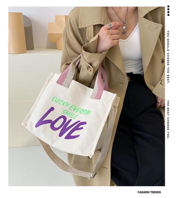 China Tote Bag Fashion Hit Canvas Handbag Letter LOVE Shopping Bag Color Printed Casual Diagonal Bag for sale