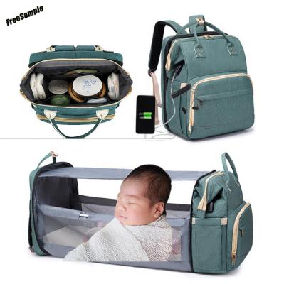 China Multifunctional Polyester Portable Crib Diaper Tote Bags For Mommy Travel Folded Nappy Backpack Hutch Usb With Free Sample for sale