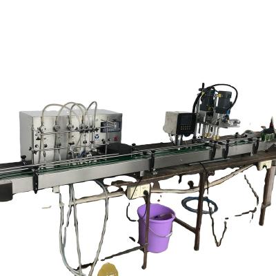 China Automatic Small 4 Heads Beverage Filling Capping Machine for sale