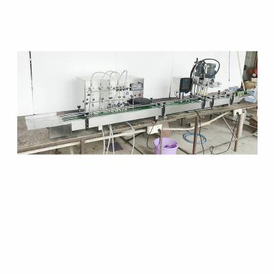 China Automatic Small 4 Heads Beverage Filling Capping Machine for sale