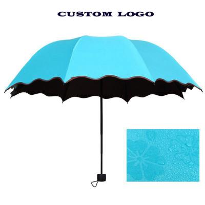 China Contemporary Magical Flower Printing Wetting Coating Black UV Sun Folding Umbrella for sale