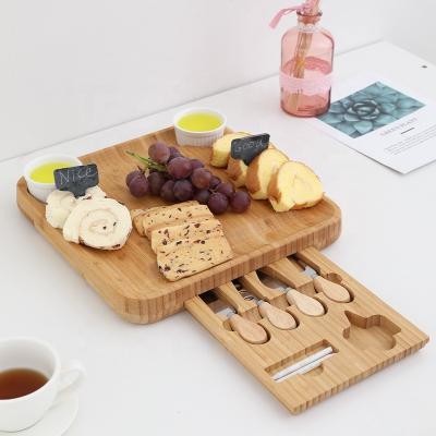 China Sustainable Bamboo Cheese Board and Knife Set Meat Tray with 4 Knife Cheese Cutting Board Set for sale