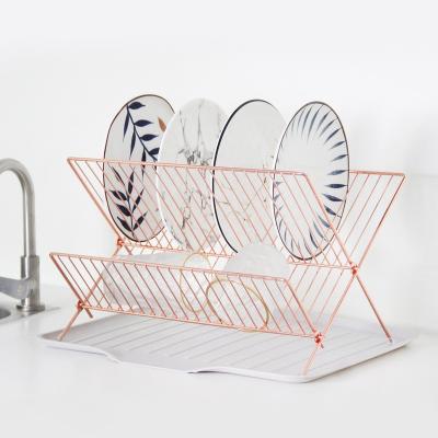 China Sustainable Stainless Steel Water Filter Holder Kitchen Rack Rose Gold Folding Drain Rack for sale