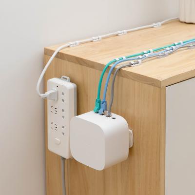 China Modern Wall Mounted Storage Hook Household Power Wall Hanging Strip Punchless Socket Holder for sale