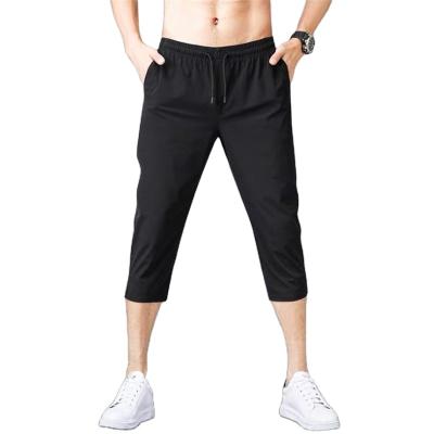 China Breathable Cropped Pants Men Sports Shorts Mens Summer Basketball Running Casual Loose Quick Dry Slim Cropped Pants for sale